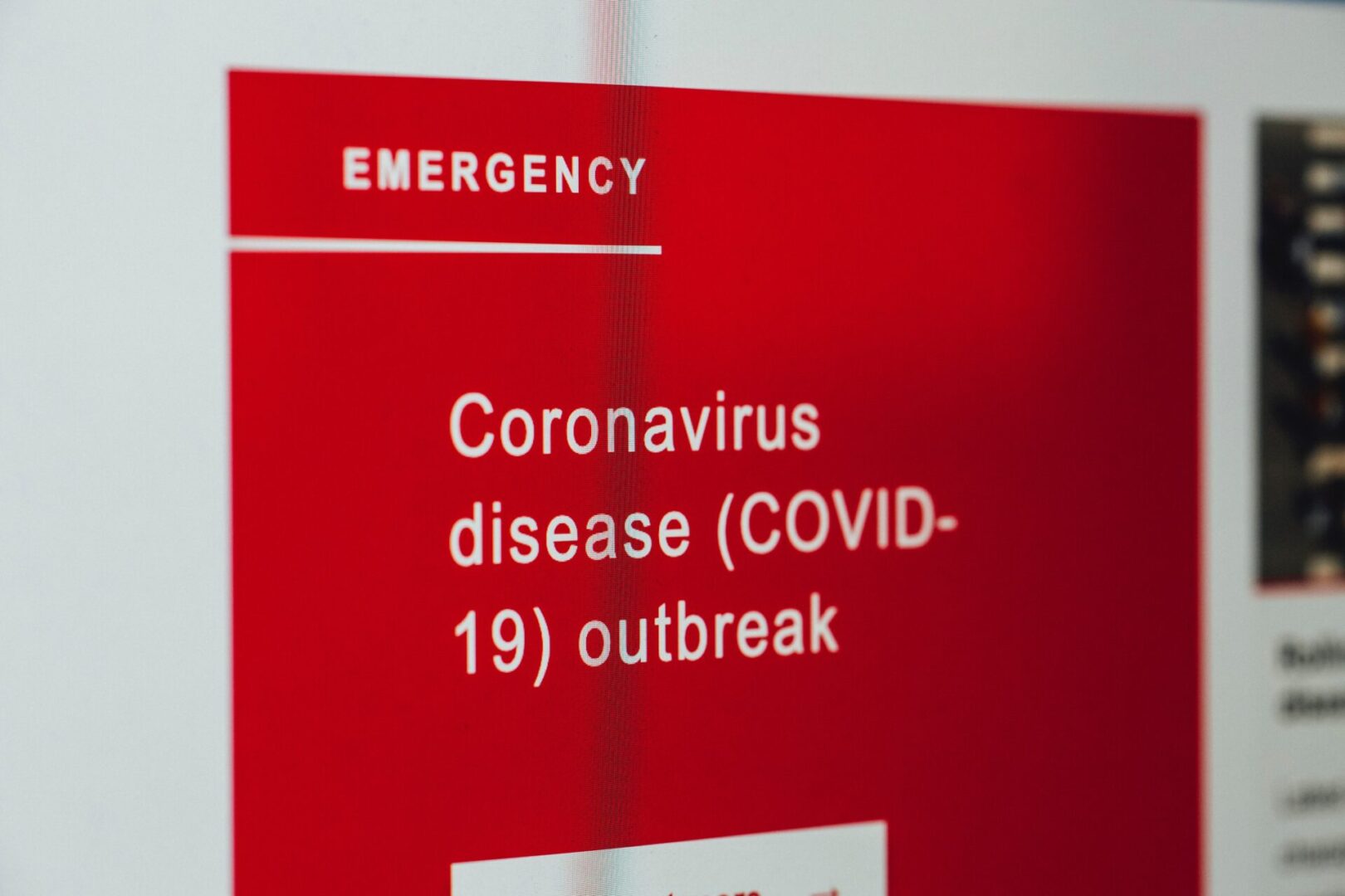 A red sign with the words " coronavirus disease ( covid-1 9 ) outbreak " written on it.