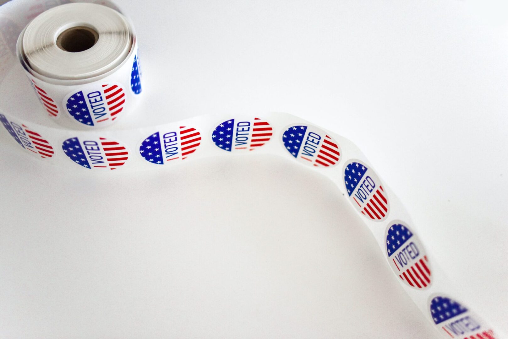 A roll of stickers with the american flag on it.