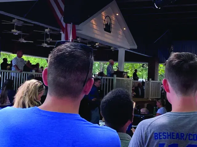 A group of people sitting in front of an audience.