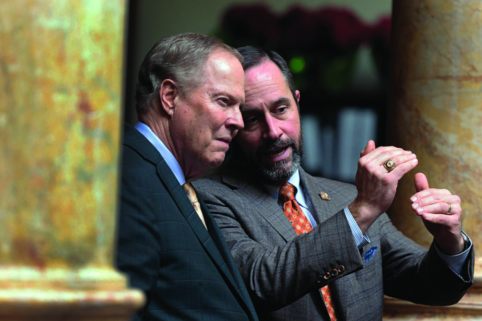 Senate Majority Whip Mike Wilson, R-Bowling Green, left, and state Sen. Christian McDaniel, R-Ryland Heights, confer Jan. 9 on the Senate floor. Photo: Legislative Research Commission 